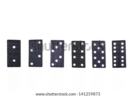 Set of dominoes pieces in a row, isolated on white background.