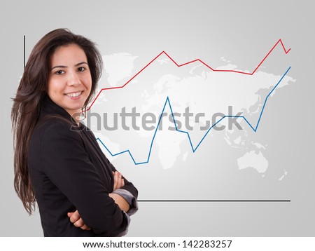 Smart business woman over world map with red and blue graph chart.
