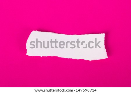 White torn piece of paper on pink background, ready for your message.