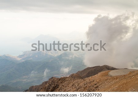High view of landscape, foggy mountain and cloudy weather.