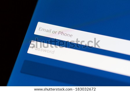 Email, phone and password login form on tablet with blue background.
