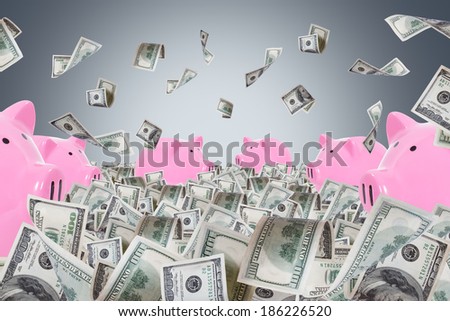 Pink piggy banks in one hundred dollar money farm and banknotes falling on dark background.