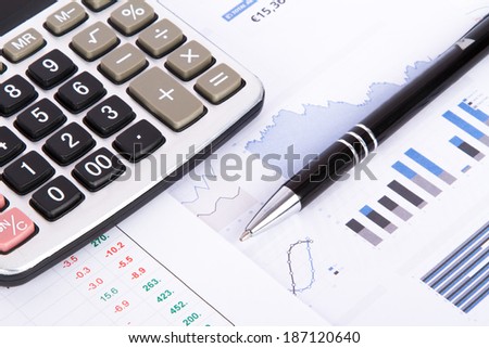 Finance concept, financial and stock market graphs, charts analysis on business table for success.