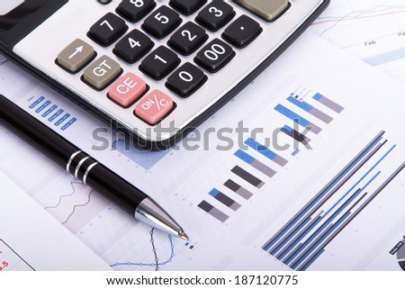 Finance concept, financial and stock market graphs, charts analysis on business table for success.