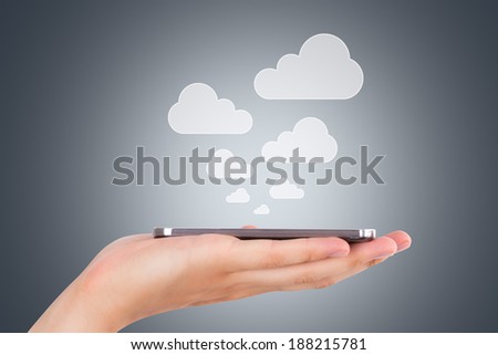 Cloud sync concept, hand holding smart phone with icons.