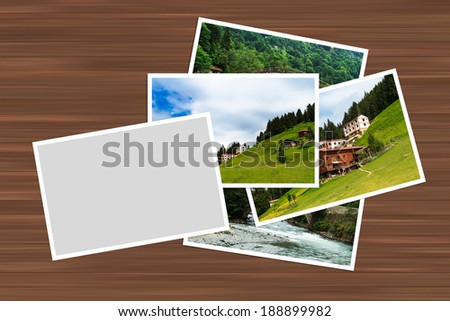 Blank white image frame with border for your photography on wooden table.