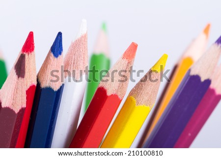 Close up view of colorful pencils for education, isolated on white background.