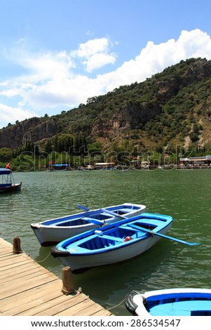 DALYAN, TURKEY - MAY 31, 2015 : Boats for touristic boat trips in the river between Koycegiz Lake and Iztuzu Beach in Dalyan.