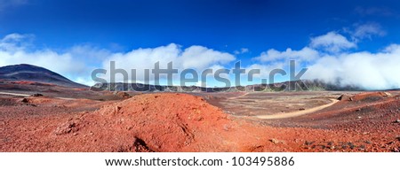 Panoramic landscape of road in volcanic landscape of Plaine des Sables, Reunion Island National Park.