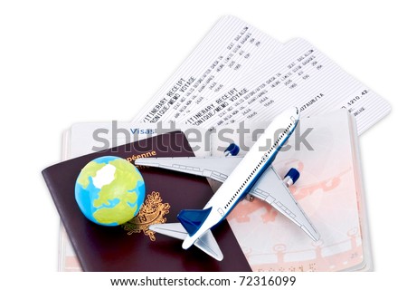 Flight tickets with passports, model of airplane and globe, isolated on white background.