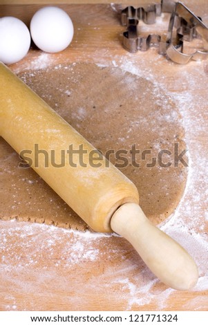 Rolling Dough for ginger breads with rolling pin