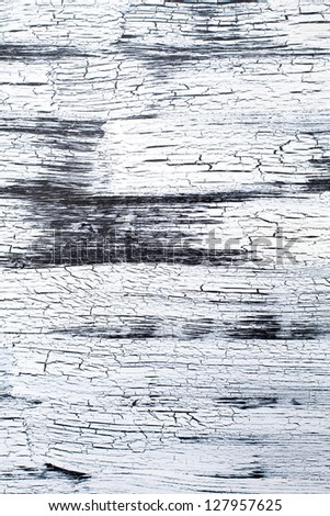Wooden Panel with cracked paint, black and white craquelure, artificial aging, background