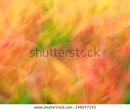 Photo art, bright Colorful light streaks abstract background in orange and green colors