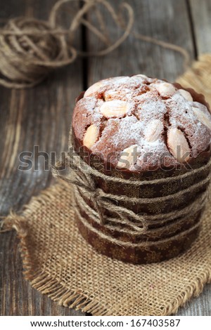 Traditional easter cake with Quail Eggs on the wooden table in rustic style, selective focus on the cake