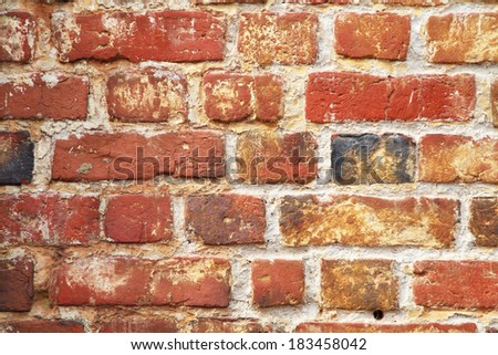 Old brickwall of yellow and red brick, texture