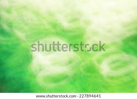 Photo art, bright Colorful light streaks abstract background in green and white colors, effect of movement