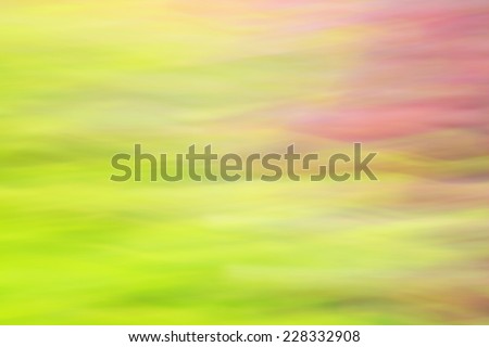 Photo art, bright Colorful light streaks abstract background in pink and green colors, effect of movement