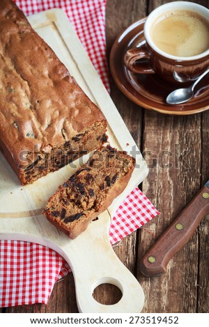 Cake with prunes and almond flour on a wooden table, selective focus