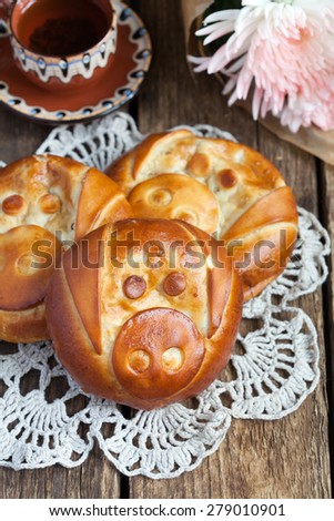 Funny food: homemade buns with apple filling in the form of pigs, selective focus, rustic style