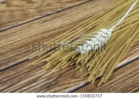 whole wheat pasta on a wooden table