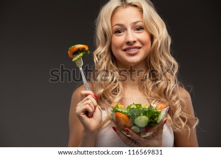 happy healthy woman with salad