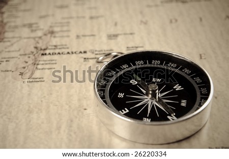compass on old world map