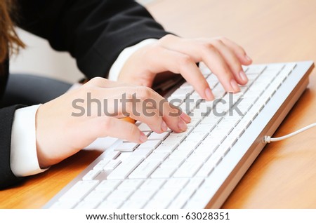 Woman typing something on keyboard
