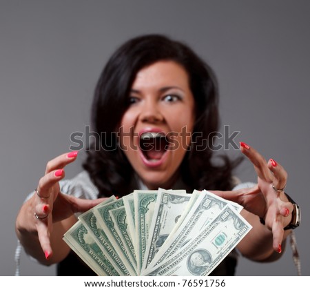 Woman and money. Focused on money.