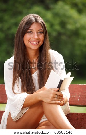  Beautiful woman reading small book - Stock Image - Everypixel