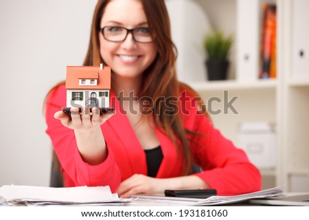 Little house toy in woman\'s hands