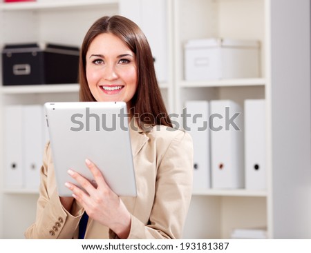 young woman using tablet in office