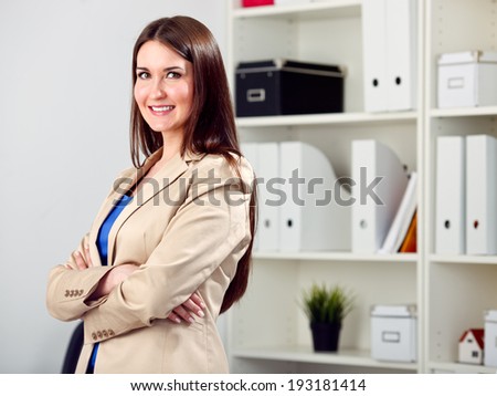 Sucessful business woman looking happy at office