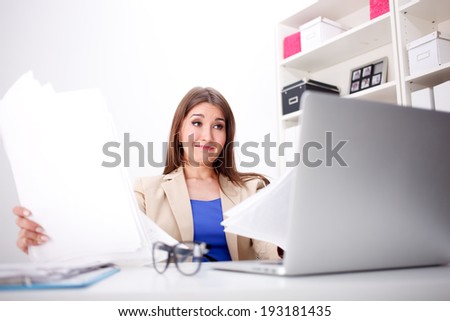 Business woman amazed and is shocked about costs in office