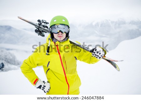 Skier carrying skis