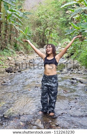 Jolly young woman in jungle