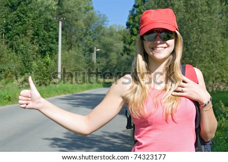 girl with rucksack stops the car