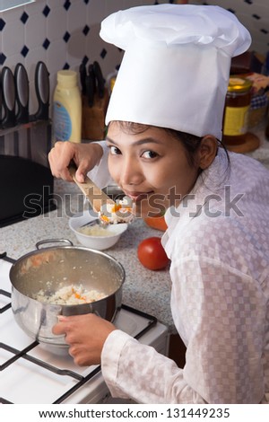 Asian woman to cook in the kitchen