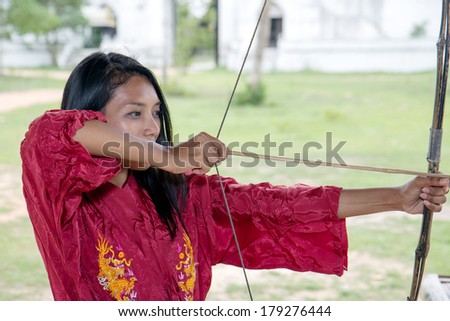 woman practicing archery