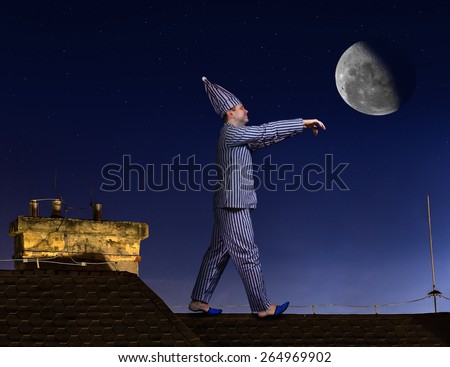 somnambulist walking on the roof on a background of the night sky with the moon