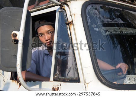 young woman driving a truck
