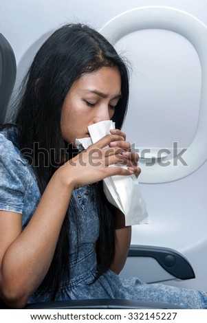 woman on the plane vomited in a paper bag
