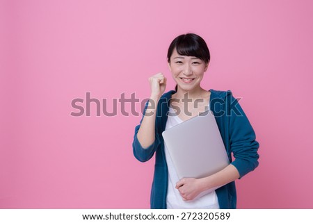 Asian university woman having laptop