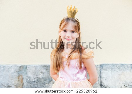 Outdoor portrait of a cute little princess