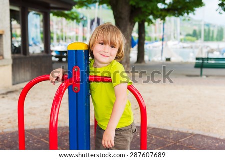 Adorable little by having fun on playground