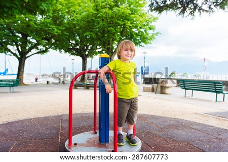 Adorable little by having fun on playground