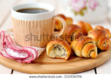 Poppy seed rugelach (croissant) with a cup of coffee (tea)