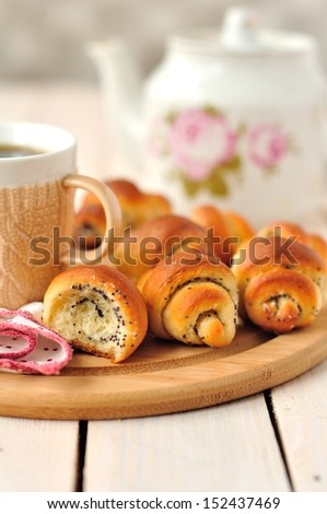 Poppy seed rugelach (croissant) with a cup of coffee (tea), copy space for your text