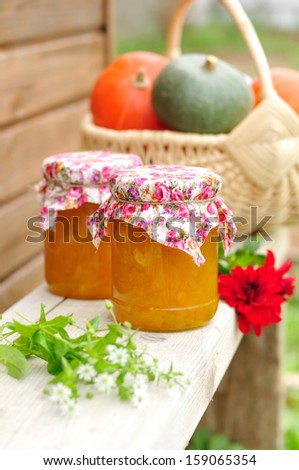 Two Jars of Pumpkin Jam on a Bench, copy space for your text