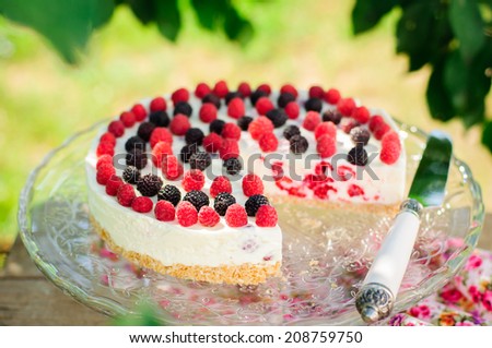 No-bake Fresh Raspberry Cheesecake with Red and Black Raspberries, Summer Cake, copy space for your text