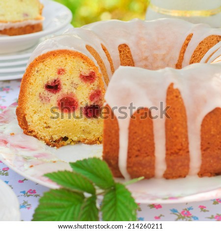 Sliced Lemon and Caraway Seed Bundt Cake with Raspberries, copy space for your text, square